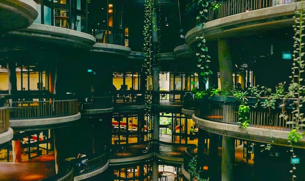 a series of round terraces form the interior of a multi-story building.